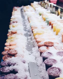 High angle view of ice and packed smoothies for sale at shop