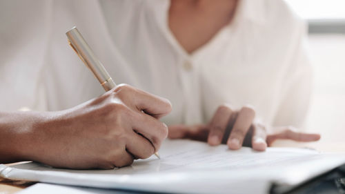 Close-up of man working on table