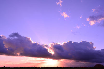Low angle view of dramatic sky during sunset
