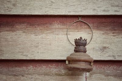 Close-up of rusty metal against wall