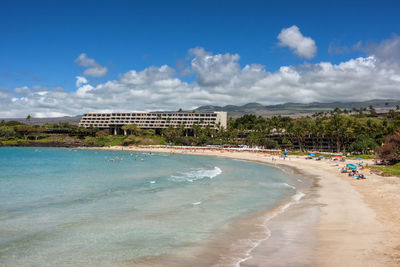 View of beach against cloudy sky