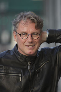 Portrait of happy man wearing black leather jacket