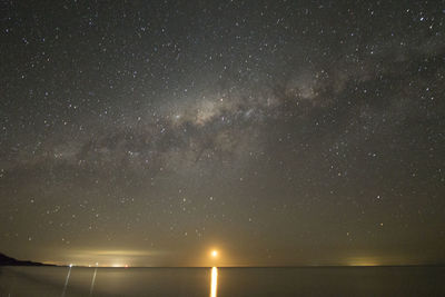 Scenic view of sea against sky at night