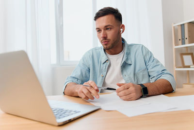 Young man working at office