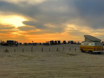 Scenic view of beach against sky during sunset