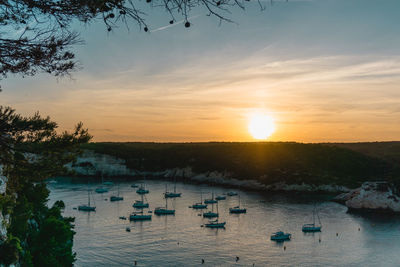 Scenic view of river against sky during sunset