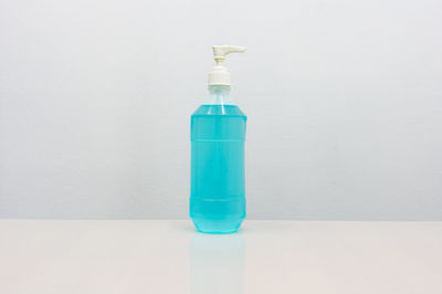 Close-up of bottle against white background