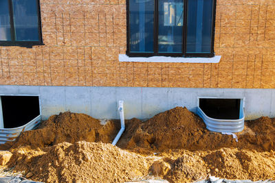 Low angle view of window on wall of building