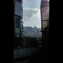 Buildings in city against sky