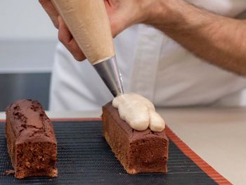 Cropped hand of man preparing food