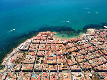 High angle view of buildings in sea