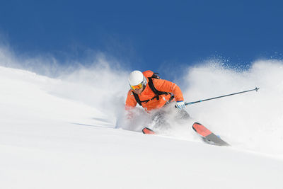 Skiing in white fresh virgin snow