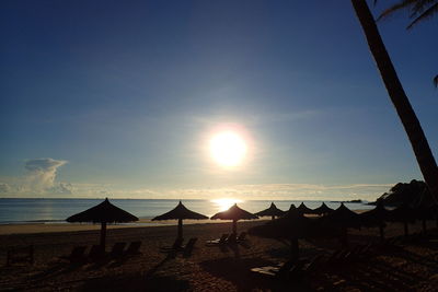 Scenic view of beach against sky during sunset