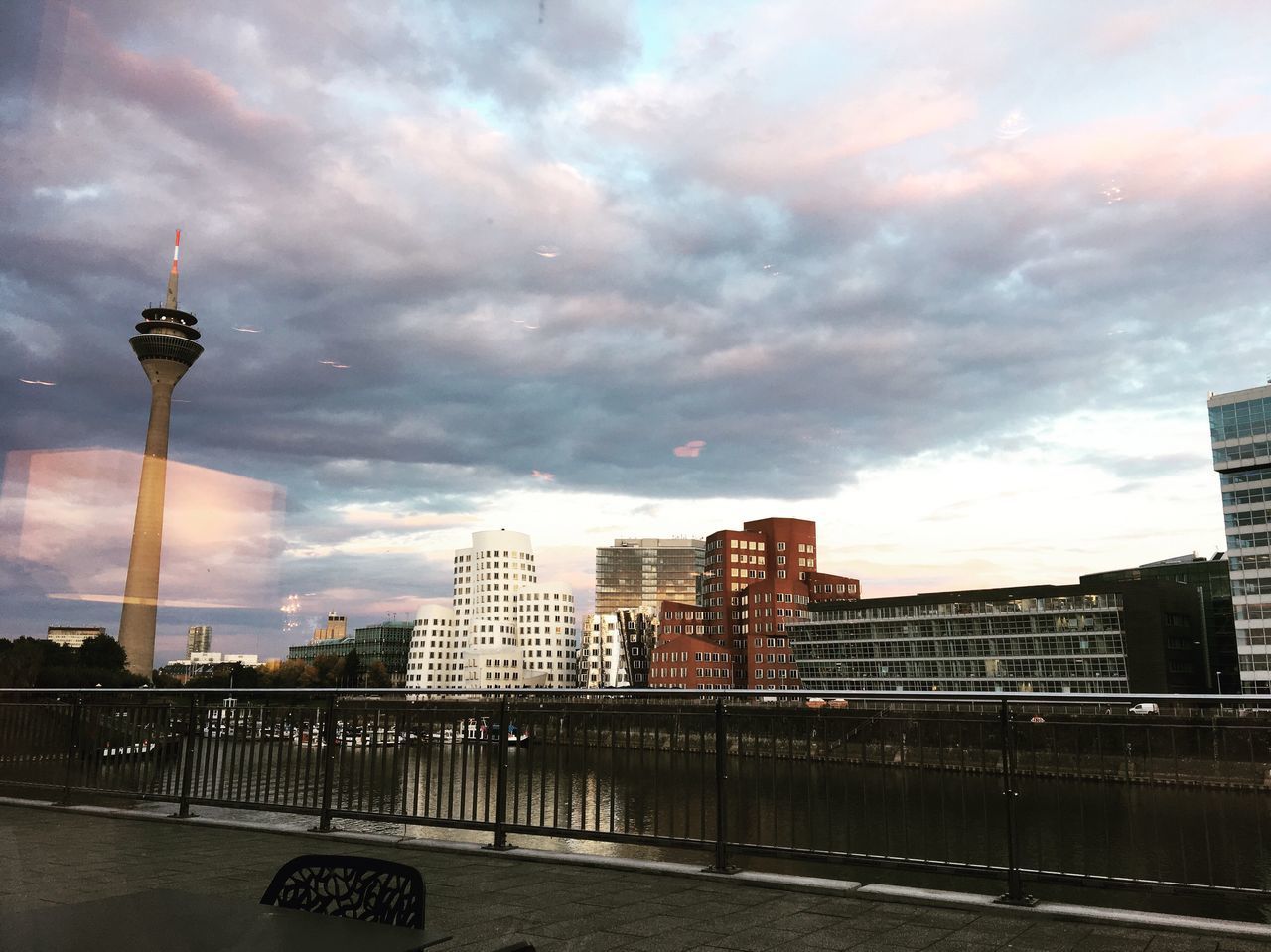 VIEW OF CITY AGAINST CLOUDY SKY