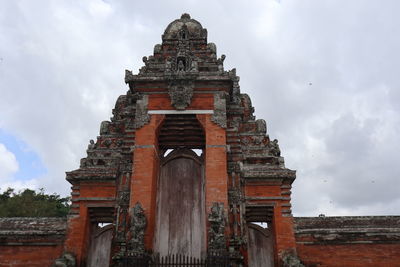 Low angle view of old building against sky