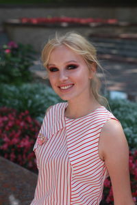 Portrait of woman wearing striped top