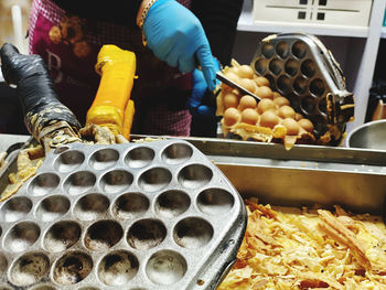 Midsection of man preparing food