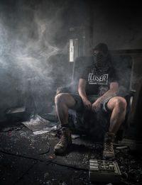 Man sitting in abandoned room