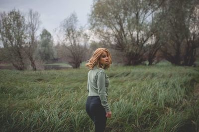 Full length of man standing on grass