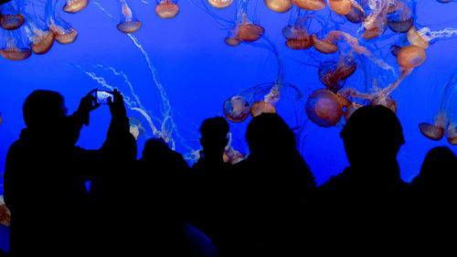 Group of people swimming in sea