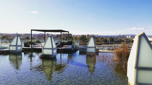 Boats in lake against sky