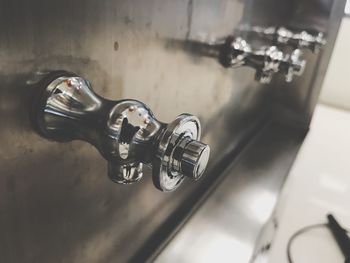 Close-up of faucet in bathroom