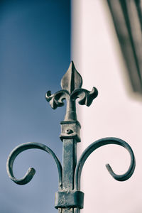 Low angle view of cross against clear sky