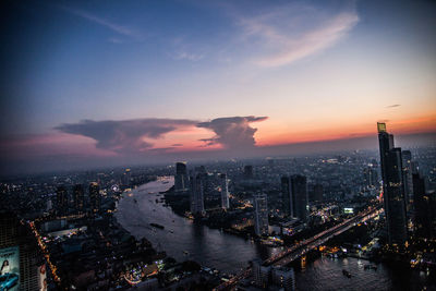 Aerial view of city at sunset