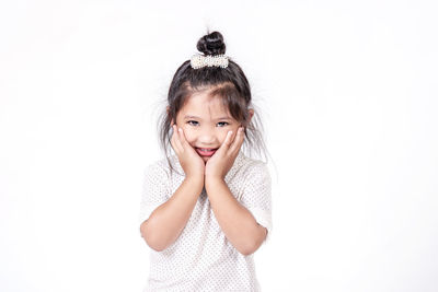 Portrait of a smiling girl over white background