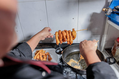 Midsection of man preparing food