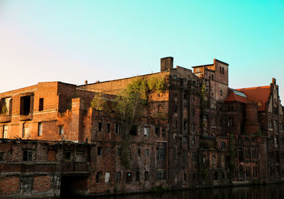 Low angle view of old building against sky