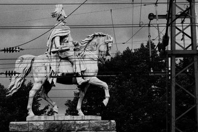 Low angle view of statue against built structure