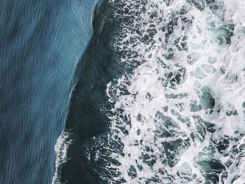 Close-up of wave splashing on rock