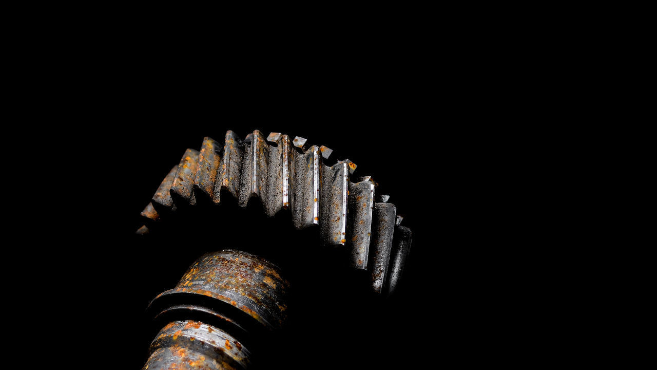 LOW ANGLE VIEW OF METAL AGAINST BLACK BACKGROUND