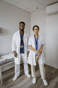 Portrait of female doctor standing in hospital