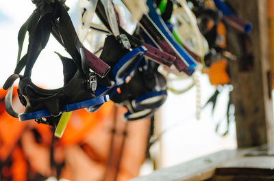 Close-up of multi colored pencils hanging on rack