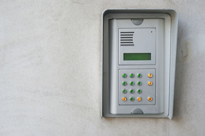 Close-up of telephone booth on wall