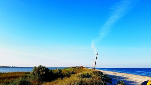 Scenic view of sea against blue sky