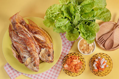 High angle view of fish in plate on table