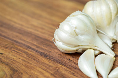 Close-up of white garlic on table