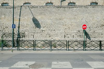 Empty road against wall