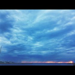 Scenic view of landscape against cloudy sky