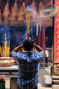 Rear view of a man at night