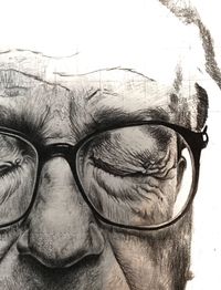 Close-up portrait of man wearing eyeglasses