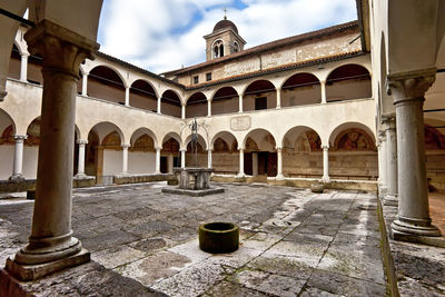 View of historic building against cloudy sky