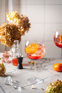 Close-up of glass with orange juice on table