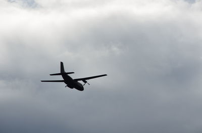 Low angle view of airplane flying in sky