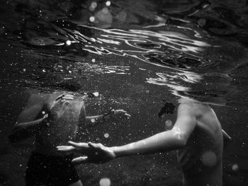 People swimming in sea