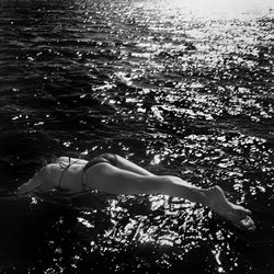 Woman swimming in sea