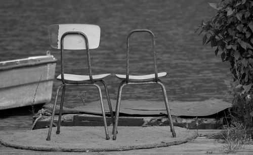 Empty chairs on beach